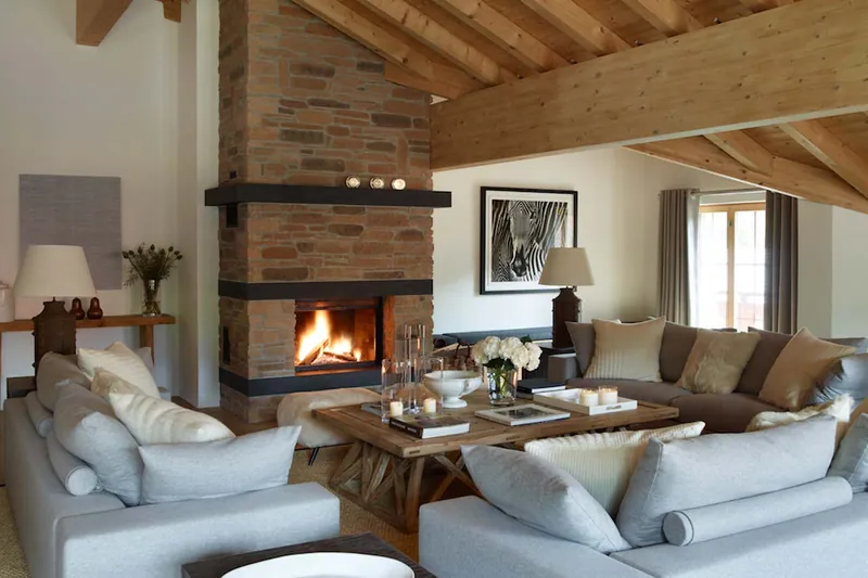 Lounge with a stone fireplace in Penthouse Emiko